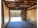 Spacious garage interior with open door for natural lighting and storage space at 17477 E Temple Dr, Aurora, CO 80015