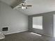 The living room features vaulted ceilings, grey walls, and a modern ceiling fan at 17477 E Temple Dr, Aurora, CO 80015