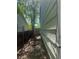 Narrow side yard with privacy fence and some landscaping at 17477 E Temple Dr, Aurora, CO 80015