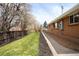 Well-maintained backyard featuring a lush lawn and a neatly landscaped perimeter at 11223 W 29Th Ave, Lakewood, CO 80215