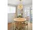 Charming dining area features a modern chandelier and cozy seating at 11223 W 29Th Ave, Lakewood, CO 80215