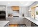 Beautiful kitchen featuring custom cabinets, stainless appliances, and ample counter space at 11223 W 29Th Ave, Lakewood, CO 80215