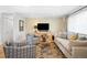 Cozy living room features a plush sofa, patterned rug, and stylish armchairs at 11223 W 29Th Ave, Lakewood, CO 80215