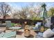 Inviting backyard patio with comfortable seating and a modern fire pit, ideal for outdoor relaxation at 11223 W 29Th Ave, Lakewood, CO 80215