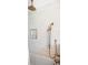 Elegant shower with white subway tile, bronze fixtures, and a convenient built-in niche for toiletries and shower products at 11223 W 29Th Ave, Lakewood, CO 80215