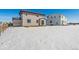The backyard features a newer construction home and a fence that surrounds the yard at 5784 Farmstead Pl, Mead, CO 80504