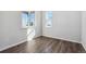 Bright bedroom featuring wood flooring and bright windows at 5784 Farmstead Pl, Mead, CO 80504
