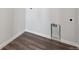 The laundry room features durable laminate flooring and convenient hookups for washer and dryer at 5784 Farmstead Pl, Mead, CO 80504