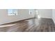Open living space with luxury vinyl flooring and an abundance of natural light at 5784 Farmstead Pl, Mead, CO 80504