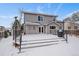 Spacious backyard deck with snow covering and grill at 2151 E 99Th Pl, Thornton, CO 80229