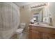 Clean bathroom with shower/tub combo, vanity, and toilet at 2151 E 99Th Pl, Thornton, CO 80229