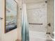 Updated bathroom with a shower/tub combo and modern vanity at 400 Zang St # 1-105, Lakewood, CO 80228