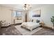 Cozy bedroom with natural light, a ceiling fan, and neutral decor for a relaxing ambiance at 400 Zang St # 1-105, Lakewood, CO 80228