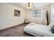 Spacious bedroom with a view, plush carpet, ceiling fan and soft neutral hues throughout at 400 Zang St # 1-105, Lakewood, CO 80228