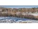 Beautiful community in a winter setting with snow and mature trees at 400 Zang St # 1-105, Lakewood, CO 80228