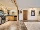 Open kitchen featuring wooden cabinets, stainless steel appliances, and a convenient layout at 400 Zang St # 1-105, Lakewood, CO 80228