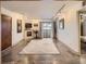 Bright living room featuring a fireplace, balcony access, and contemporary furnishings at 400 Zang St # 1-105, Lakewood, CO 80228