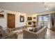 Cozy living room with fireplace, sliding doors to balcony, and modern decor at 400 Zang St # 1-105, Lakewood, CO 80228