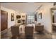 Bright living room featuring a fireplace, balcony access, and contemporary furnishings at 400 Zang St # 1-105, Lakewood, CO 80228