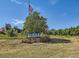 Entrance to Union Ridge Park featuring an American flag and community sign at 400 Zang St # 1-105, Lakewood, CO 80228