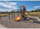 Community playground equipment featuring a slide, climbing area, and swings for active play at 400 Zang St # 1-105, Lakewood, CO 80228