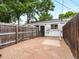 Backyard with gravel, flagstone patio, and wooden fence at 2528 N Gilpin St, Denver, CO 80205