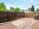 Backyard with gravel, flagstone patio, and wooden fence at 2528 N Gilpin St, Denver, CO 80205