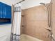 Bathroom features a shower/tub combo and blue vanity at 2528 N Gilpin St, Denver, CO 80205