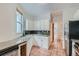 Updated kitchen with white cabinets and tile flooring at 2528 N Gilpin St, Denver, CO 80205