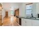 Modern kitchen with white cabinets and a large sink at 2528 N Gilpin St, Denver, CO 80205