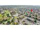 An aerial view of property shows its nestled in a neighborhood with ponds, trees and other community features at 201 Wright St # 105, Lakewood, CO 80228