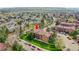 Community aerial view featuring condo buildings with street and parking areas at 201 Wright St # 105, Lakewood, CO 80228