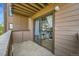 Cozy balcony with sliding glass door, offering a glimpse of the interior living space at 201 Wright St # 105, Lakewood, CO 80228