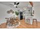 Modern kitchen features gray cabinetry, stainless steel appliances, and an adjacent dining area at 201 Wright St # 105, Lakewood, CO 80228