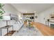 Spacious living room with seamless transition to the dining area and updated kitchen at 201 Wright St # 105, Lakewood, CO 80228