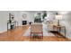 Cozy living room with fireplace, hardwood floors, and neutral furniture at 201 Wright St # 105, Lakewood, CO 80228