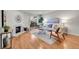 Bright living room with fireplace, hardwood floors, and sliding door to balcony at 201 Wright St # 105, Lakewood, CO 80228