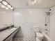 Stylish bathroom with modern fixtures, subway tile and unique patterned flooring at 1260 York St # 104, Denver, CO 80206