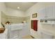 Bright bathroom featuring a walk-in tub and white cabinetry at 8040 W 78Th Way, Arvada, CO 80005