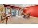 Bright dining room featuring slider to sunroom; great for entertaining or enjoying the view at 8040 W 78Th Way, Arvada, CO 80005