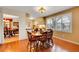 Dining room with wood floor, wooden table and plenty of light at 8040 W 78Th Way, Arvada, CO 80005