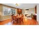 Cozy dining room features a brick fireplace, and large window offering natural light at 8040 W 78Th Way, Arvada, CO 80005