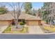 Charming brick home with a well-maintained lawn, mature trees and a two-car garage at 8040 W 78Th Way, Arvada, CO 80005