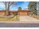Charming brick home with a well-maintained lawn, mature trees and a two-car garage at 8040 W 78Th Way, Arvada, CO 80005