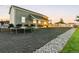 Backyard with lounge, trampoline and ample room for recreational activities at twilight at 10080 E 160Th Pl, Brighton, CO 80602