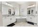 Bright bathroom featuring dual vanities, granite counters, tile floors, and a luxurious soaking tub with subway tile surround at 10080 E 160Th Pl, Brighton, CO 80602