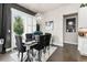Elegant dining room with a chandelier, dark furniture, and natural light at 10080 E 160Th Pl, Brighton, CO 80602