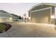 Wide driveway, a basketball hoop and attached garages provide ample parking and curb appeal at 10080 E 160Th Pl, Brighton, CO 80602
