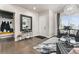 Inviting entryway with hardwood floors, modern chandelier, and convenient coat storage at 10080 E 160Th Pl, Brighton, CO 80602