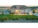 Charming home featuring well-maintained landscaping, lush green lawn, and a welcoming front porch at 10080 E 160Th Pl, Brighton, CO 80602